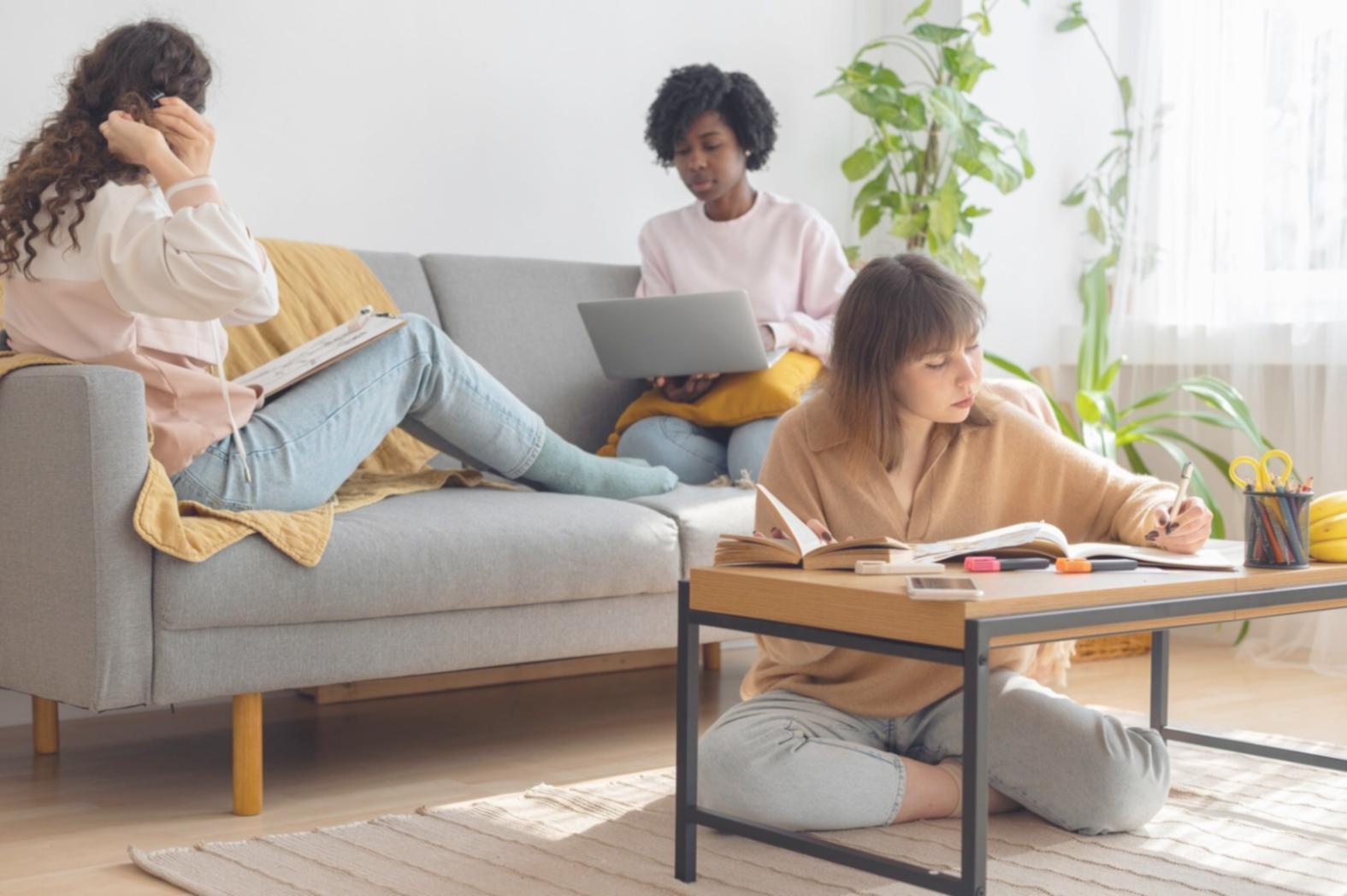 Financial analysts reviewing company reports and data charts during research session